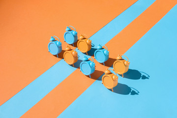 Colorful clocks on vibrant background.