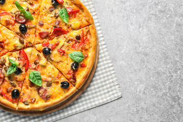 Delicious pizza with olives and sausages on table, top view