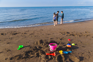 Kids playing at the beach during vacation