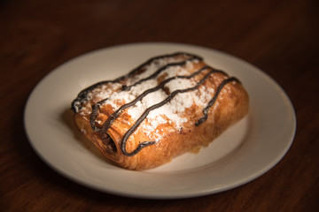 bread and chocolate on white dish