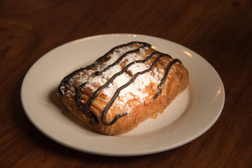 bread and chocolate on white dish