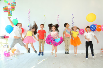 Cute little children at birthday party indoors