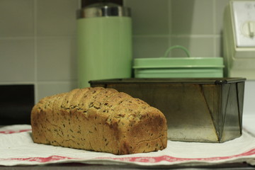 homemade sourdough bread being baked in a home kitchen resting cooling off