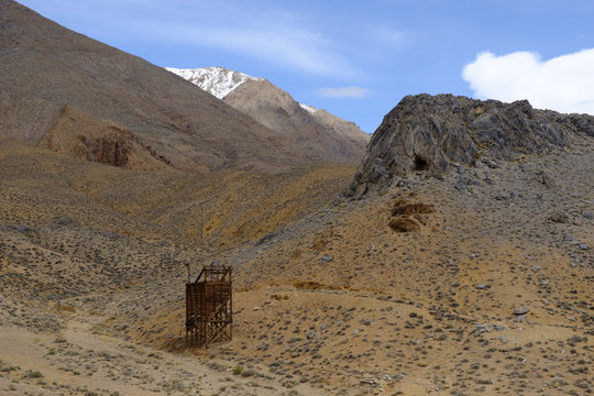 Abadoned mineshafts and associated wooden structures dot the Sierra Mountain landscape of Eastern California