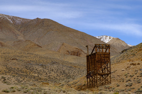 Abadoned mineshafts and associated wooden structures dot the Sierra Mountain landscape of Eastern California