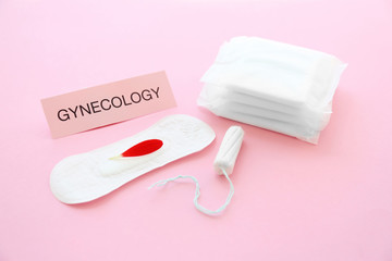 Composition with tampon and menstrual pads on color background. Gynecological care