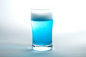 Glass of blue liquid