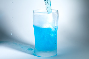 Glass of blue liquid