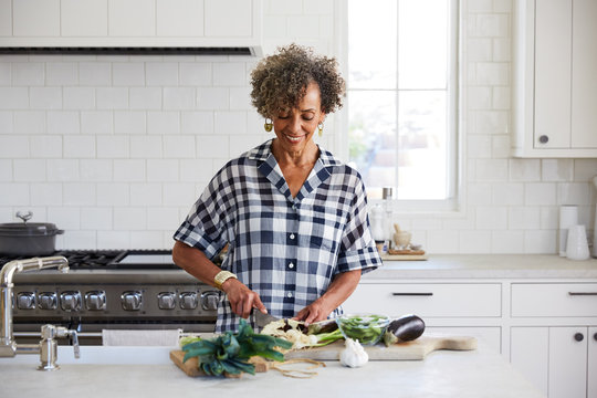 African American senior woman cooking in the kitchen