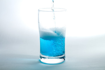 Glass of blue liquid
