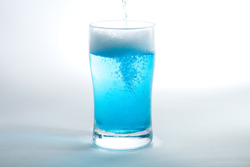 Glass of blue liquid