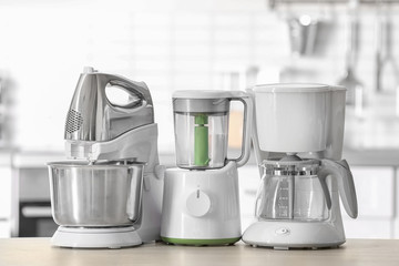 Kitchen appliances on table against blurred background