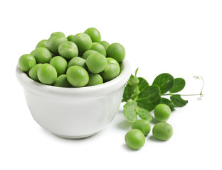 Bowl with delicious fresh green peas on white background