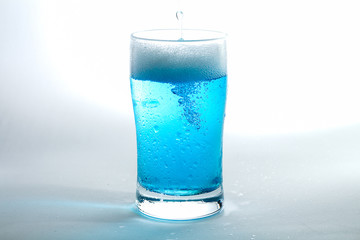 Glass of blue liquid