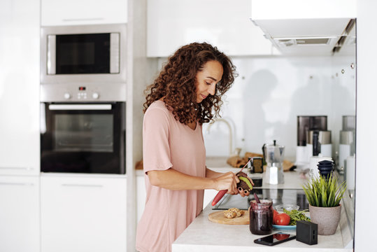 Woman cooking lunch in kitchen