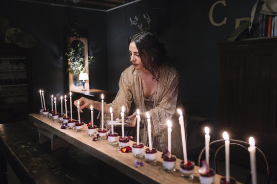 Woman preparing little cheesecakes