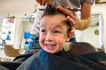 Cute Child Get a Haircut at the Barbershop