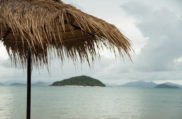 Fototapeta na wymiar Thatched umbrellas with sea view of mak island trat province Thailand