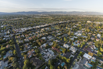 Afternoon aerial view of Encino homes and streets in the San Fernando Valley area of Los Angeles,...