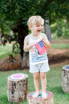 Child holding American flag