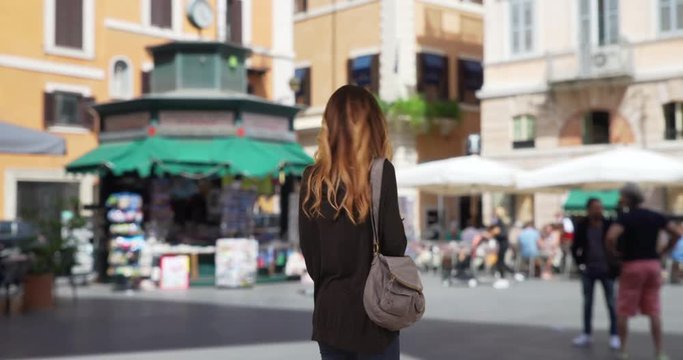 Caucasian girl in her 20s using smartphone for directions, Lost tourist using app on cellphone and looking around, 4k