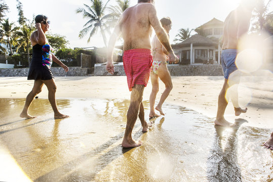 Senior Friends Having Fun At The Beach