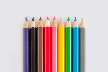 Group of graphite and color pencil, green rubber on white background with space copy