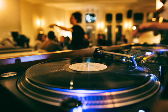 DJ Spinning Vinyl in Restaurant