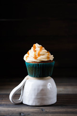 Caramel cupcakes on a dark background