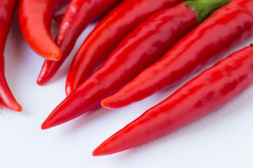 Bitter, red pepper on a white background.