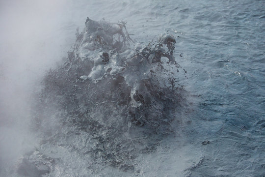 splashing mud in geothermal area in Iceland