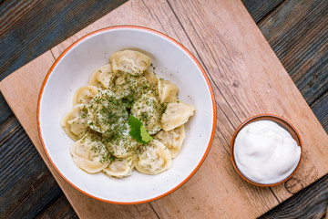 Dumplings with sour cream and herbs