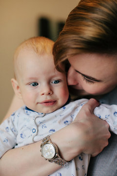 Closeup view of cuddling mother and baby son