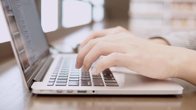 Male hands of young businessman or university student typing on laptop computer keyboard in working space. freelance lifestyle or educational research concepts. 4K video