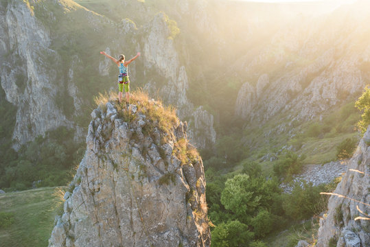 Female alpinist overlooking on breathtaking nature scenery