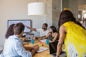 Business people at staff meeting.