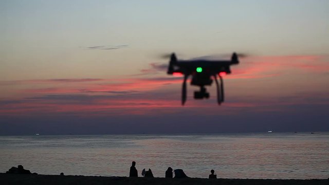 drone making an aerial movie at Karon beach during sunset