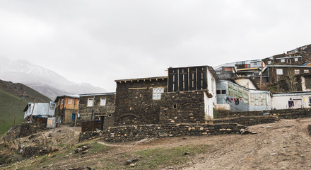 Fototapeta na wymiar Azerbaijan, Khinalig mountain settlement view, houses of local residents. Located high up in the mountains of Quba Rayon, Azerbaijan.