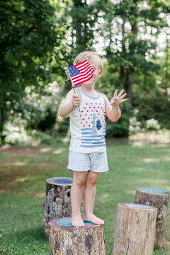Child holding American flag