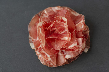 Italian prosciutto crudo or jamon. Raw ham. Top view