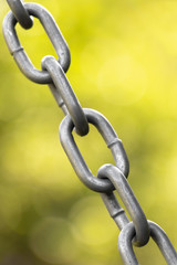 Part of the metal chain of the garden swing.