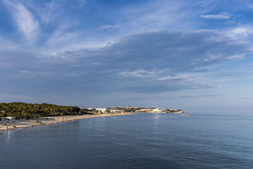 Fototapeta na wymiar Coastal mediterranean blue landscape with quiet water on a sunny day