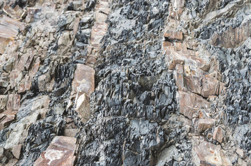 Layered rocks on steep background image