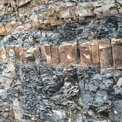 Layered rocks on steep background image
