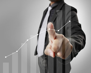 Businessman with financial symbols coming
