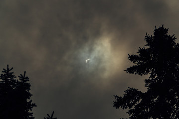 Total solar eclipse on a cloudy day