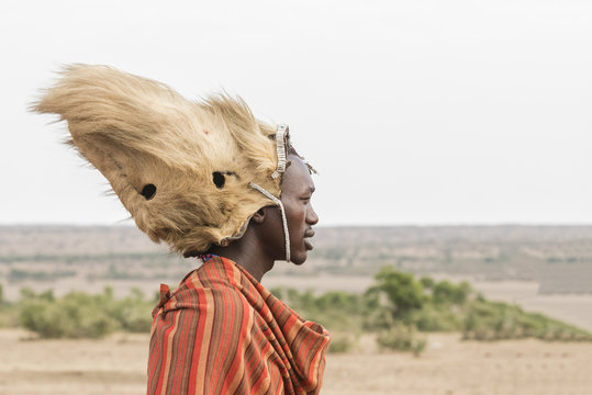 Maasai man with a lion's mane on his head