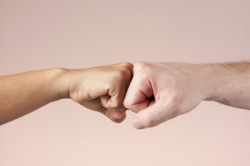 Two fists bumping each other