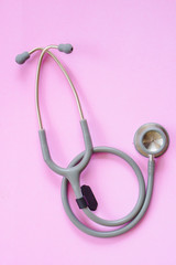 Close up the stethoscope on pink background.
