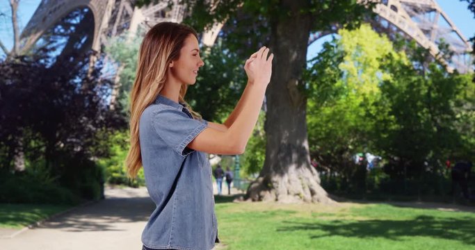Woman tourist taking pictures of summer vacation in Paris, Caucasian woman taking photos with smartphone outdoors smiling, 4k